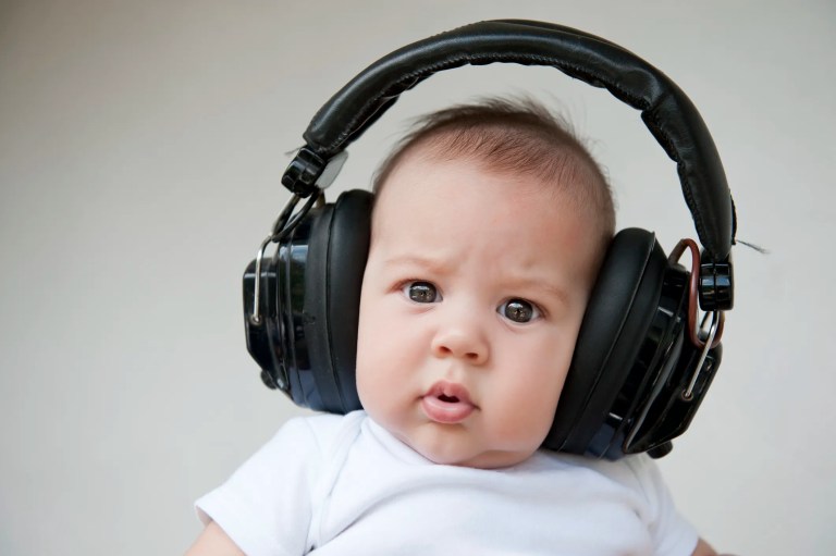 Baby wearing huge headphones