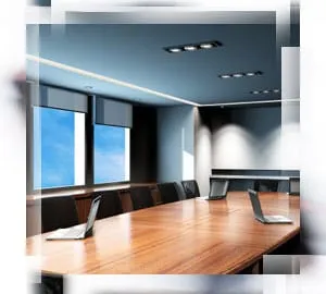 A conference room with lighting that follows office lighting standards