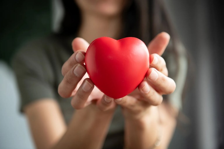 Woman holding heart
