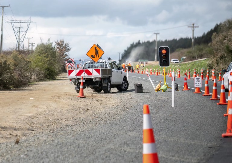 Cones lined up on roadside to block traffic during AS 1742.3-2019 roadwork.