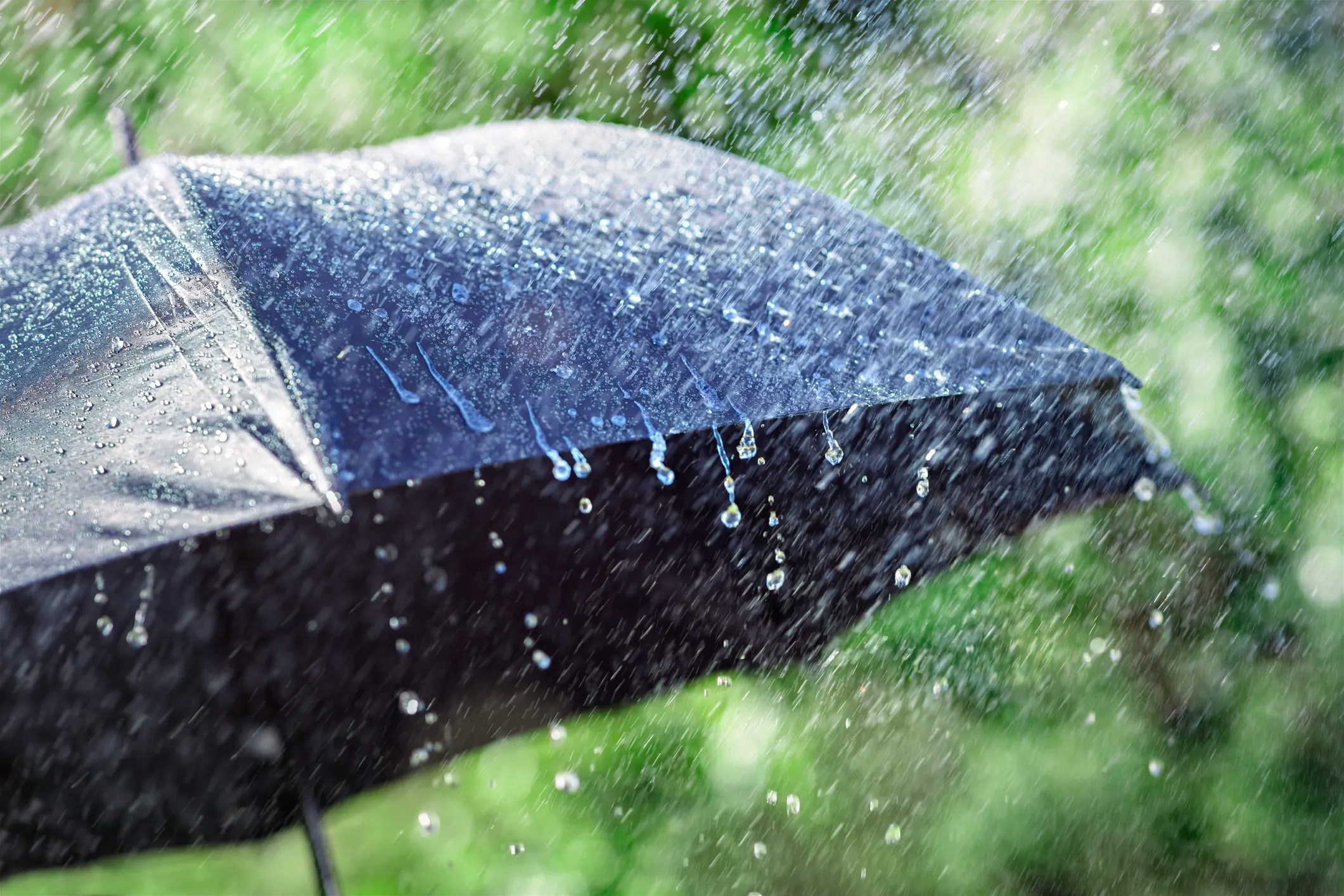 Black umbrella on a rainy day that would have followed ASTM D4112-02.