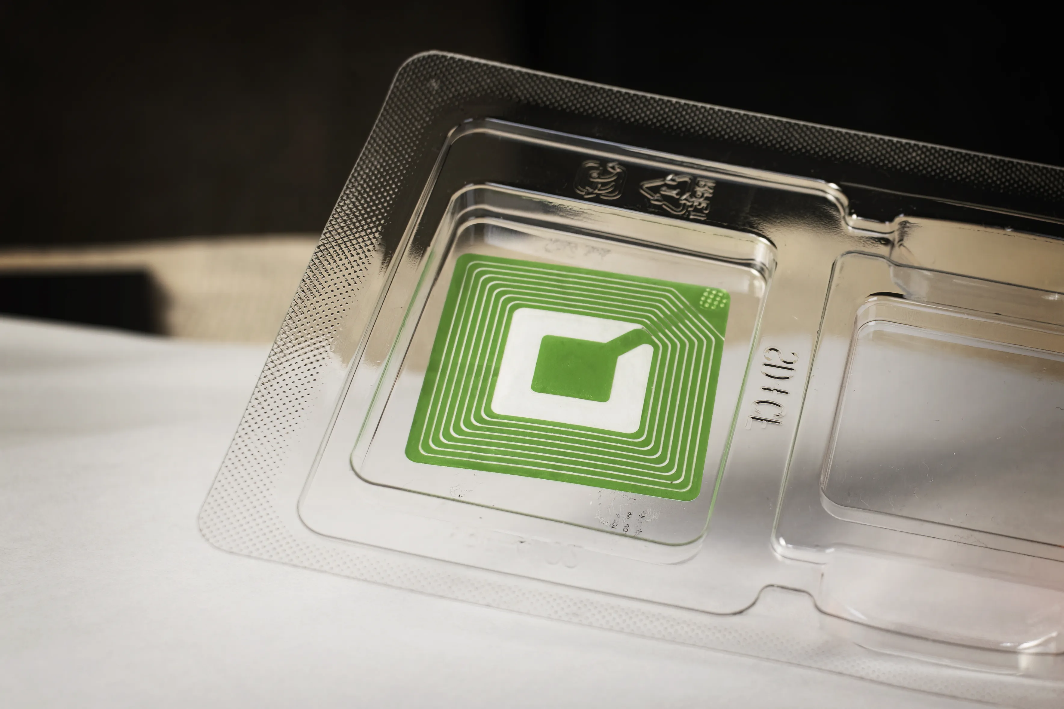 Recyclable plastic container with green RFID tag