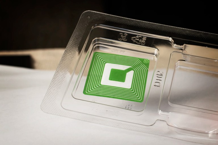 Recyclable plastic container with green RFID tag