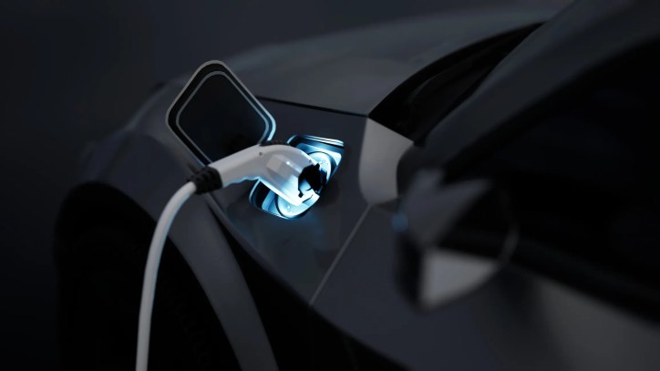 Black EV plugged in