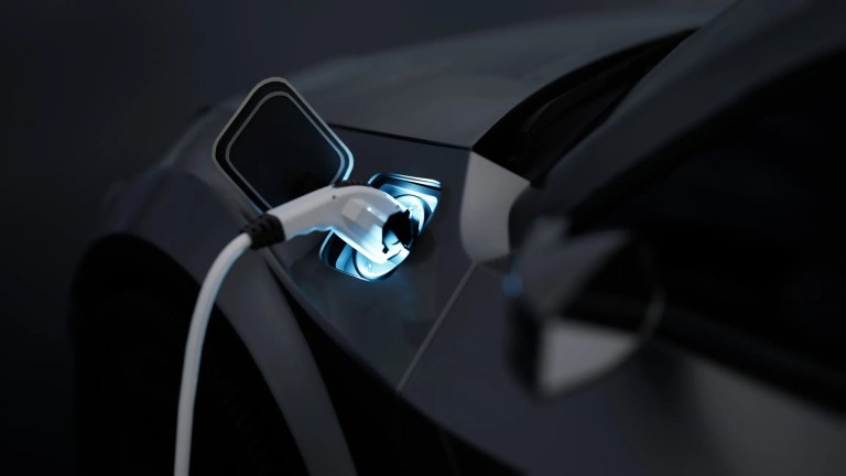 Black EV plugged in