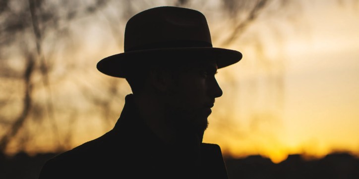 Noir detective at sunset