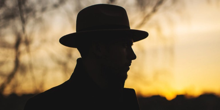 Noir detective at sunset