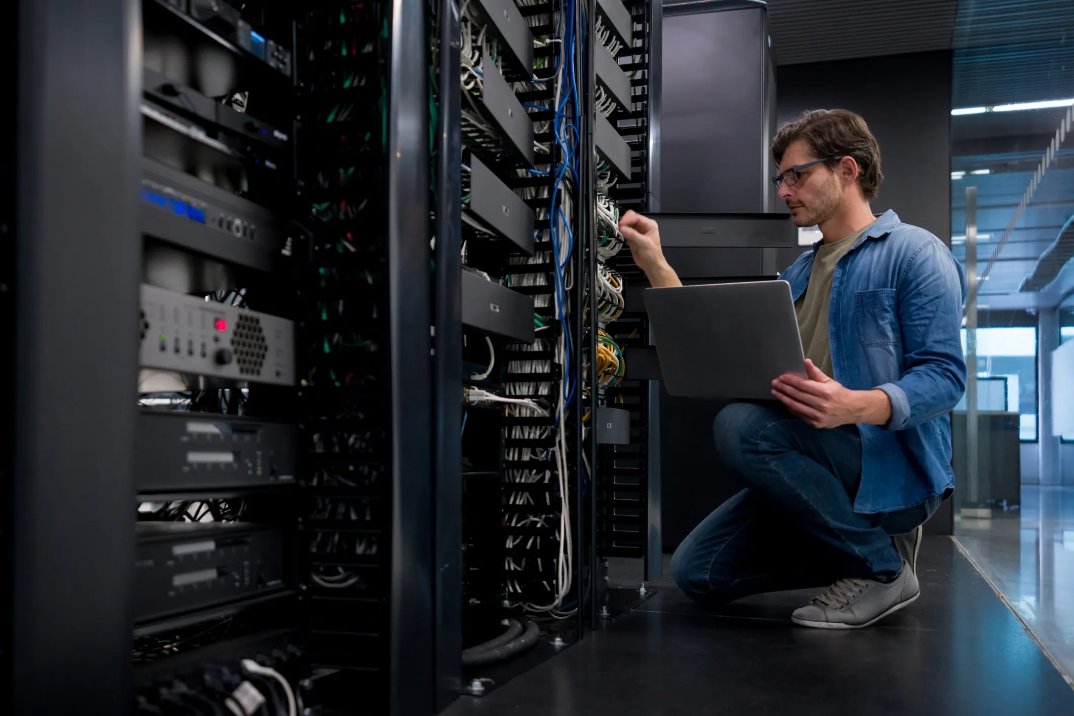 Cybersecurity worker in server room