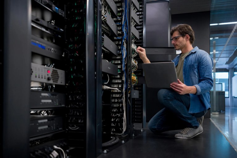 Cybersecurity worker in server room