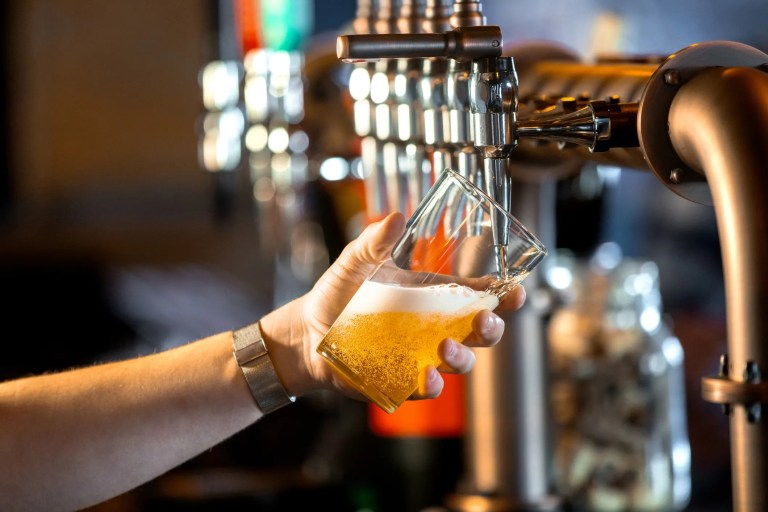 Craft beer pouring from tap