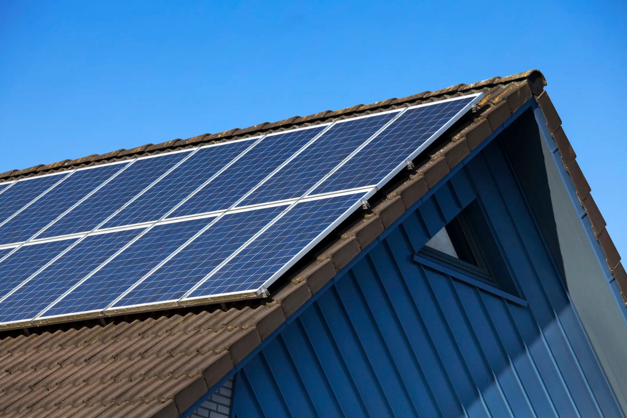 Solar panels on house beneath blue sky, which can be stolen
