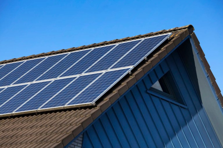 Solar panels on house beneath blue sky, which can be stolen