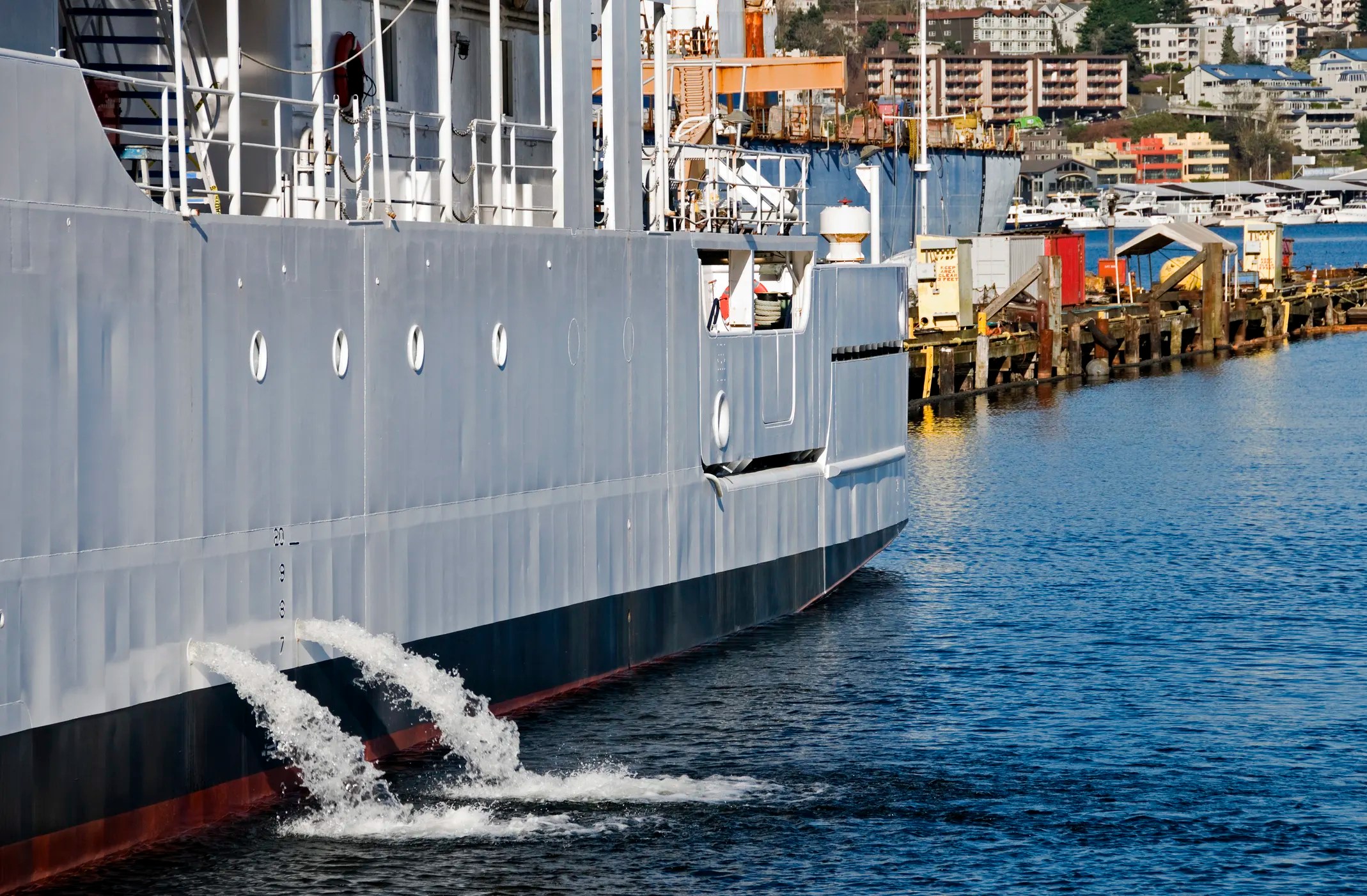 Discharging ballast water into lake from ISO 16145-1 painted steel ship