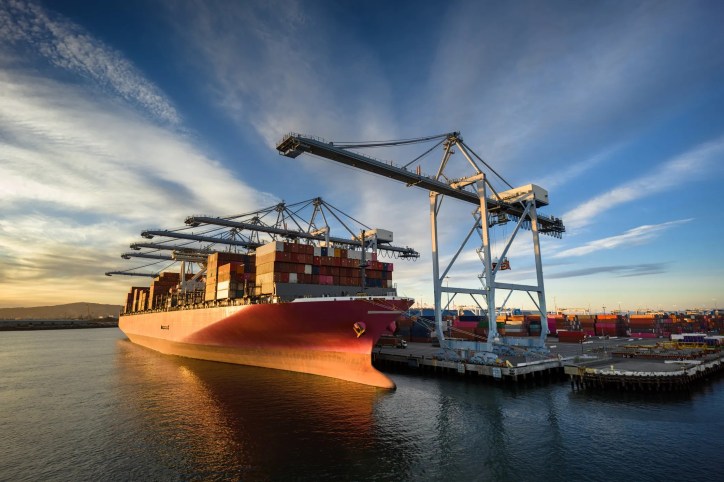 Cargo shop unloading import containers into harbor