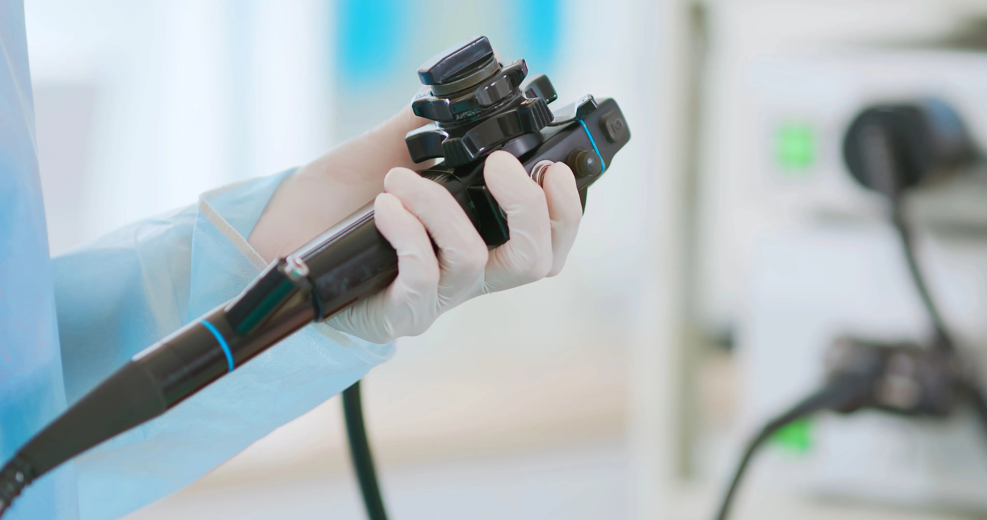 Doctor holding black endoscope following ISO 13485.