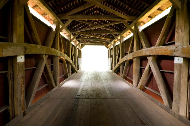 Inside Pennsylvania covered bridge with wooden trusses