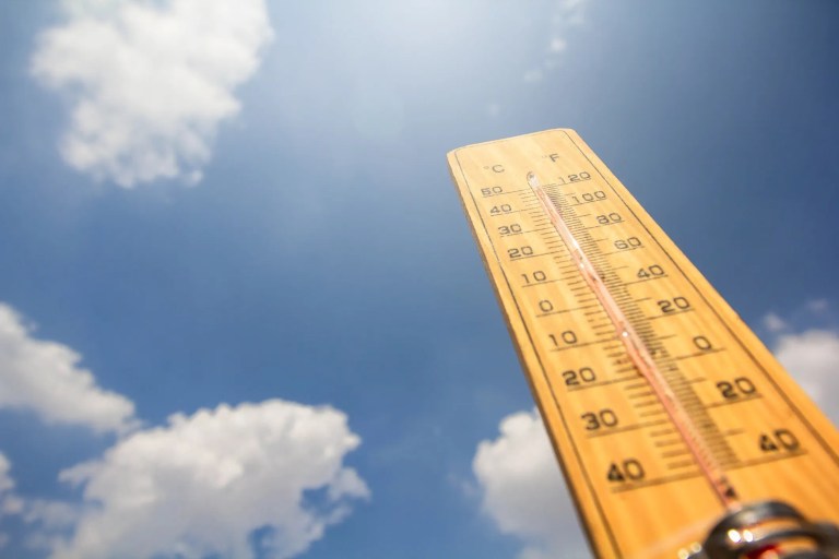 Thermometer temperature rising outside to show that it's getting warmer from climate change