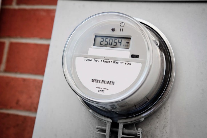 Smart meter closeup on red brick wall, showing no danger or harm