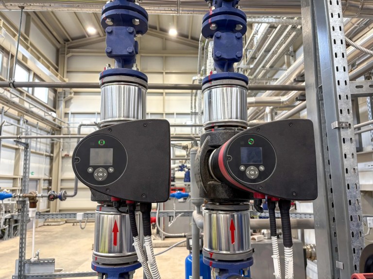 Smart valves on blue water pumps in manufacturing plant