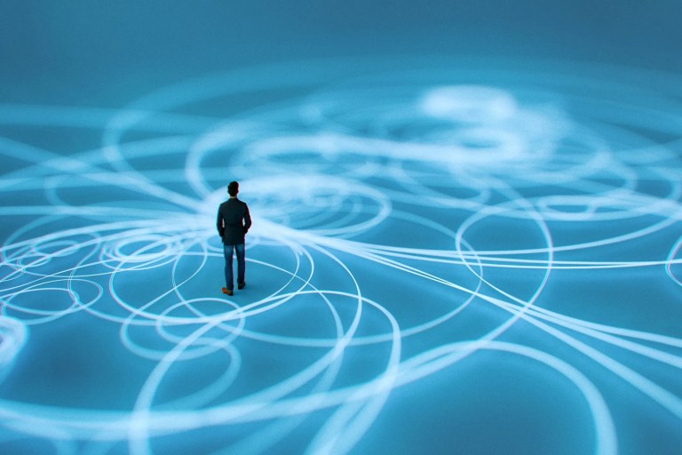 Businessman standing in curled line blue digital graphic to show overcoming singularity