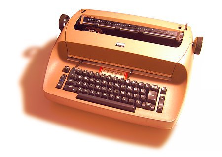 A brown IBM Selectric typewriter, which used the first backspace key.