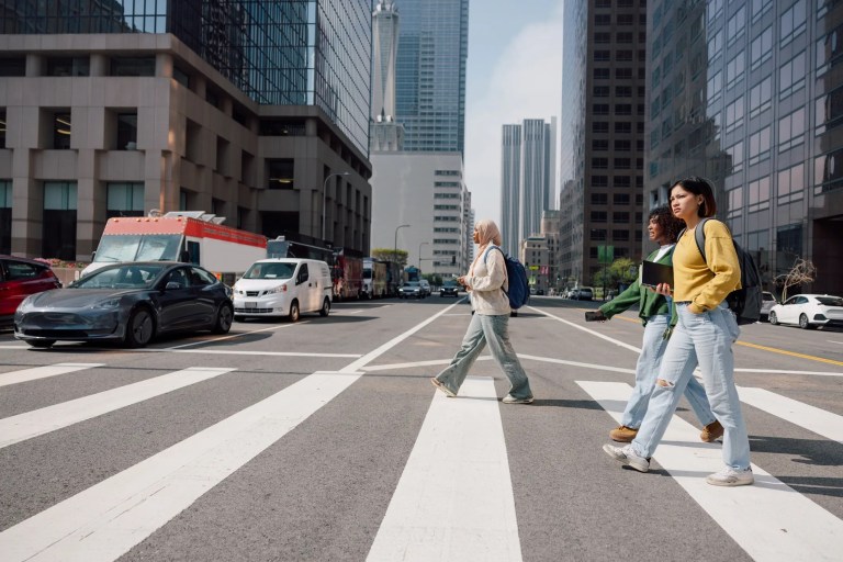 Female students crossing street in downtown Los Angeles