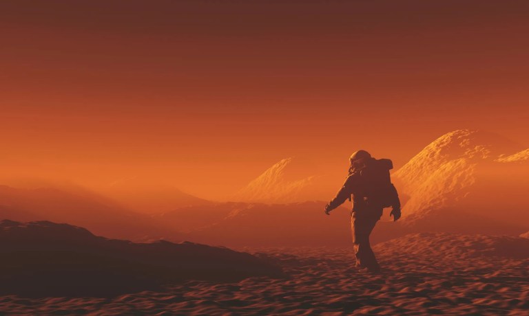 Astronaut walking on Mars, the hazy red planet