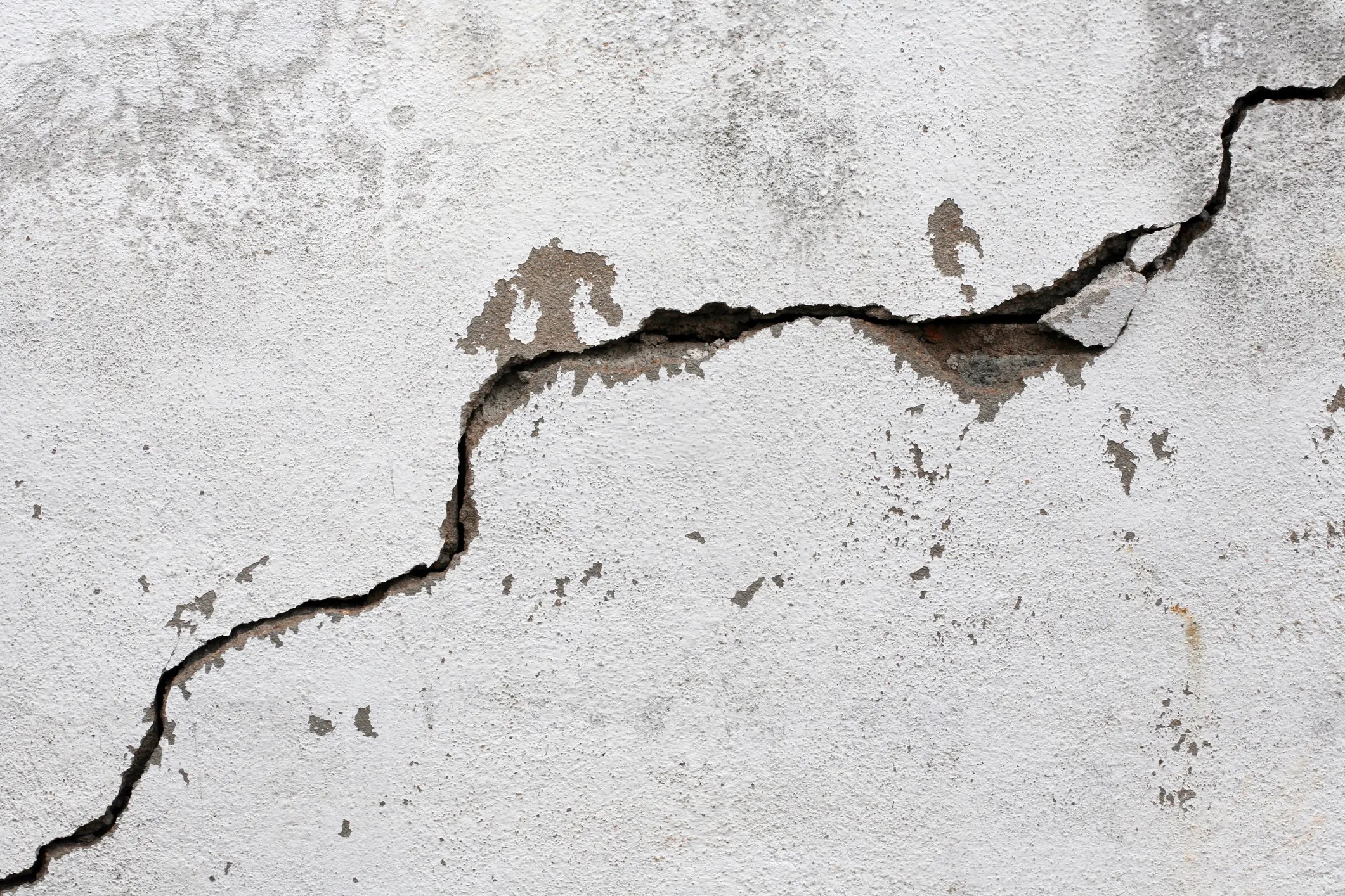 Crack on white wall from seismic activity