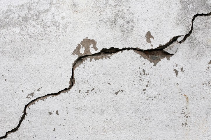 Crack on white wall from seismic activity