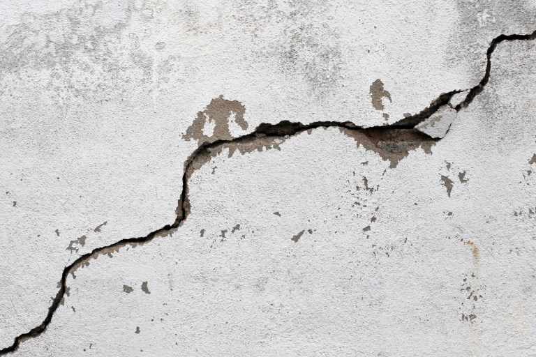 Crack on white wall from seismic activity