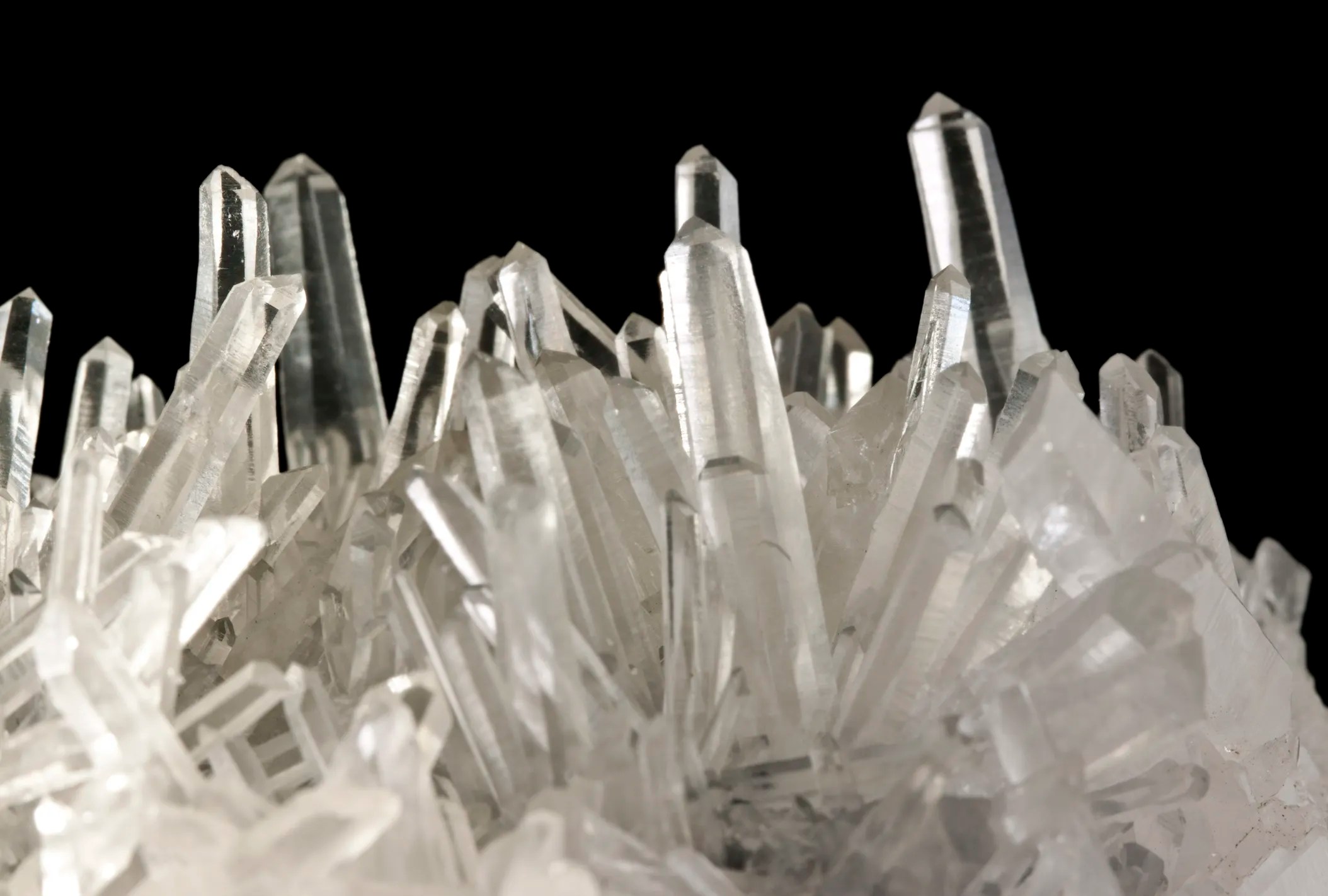 Synthetic quartz crystals grown in front of black background with IEC 60758 requirements