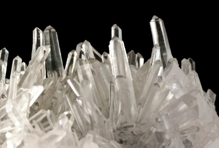 Synthetic quartz crystals grown in front of black background with IEC 60758 requirements