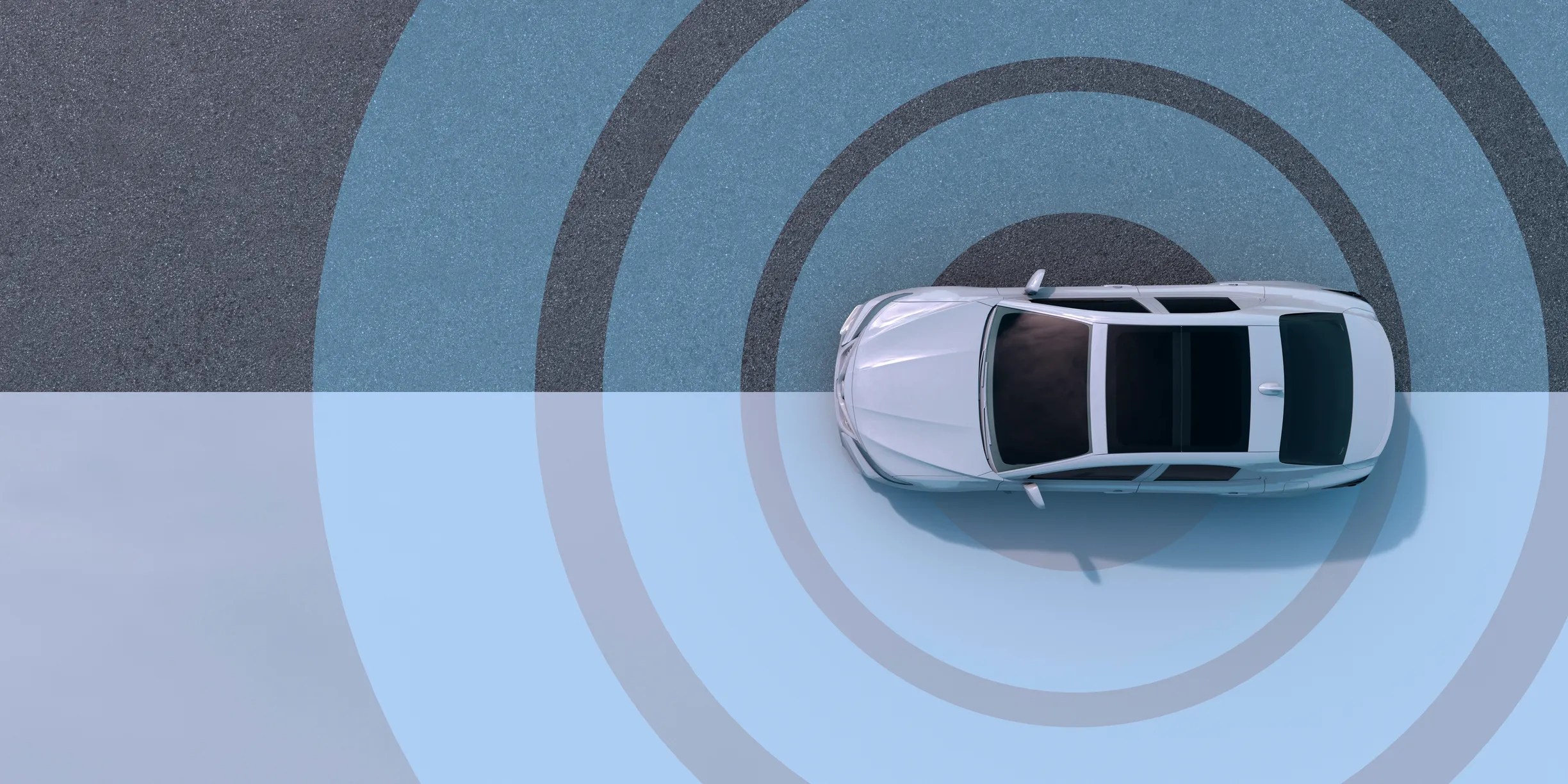 Self driving car moving on road with blue circles detecting nearby traffic