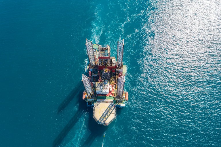 Aerial view of an offshore oil rig working to gather ISO 14224 data