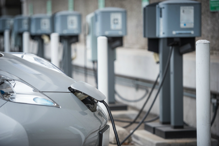 An EV plugged into an IEC 61851 electric vehicle charging system.