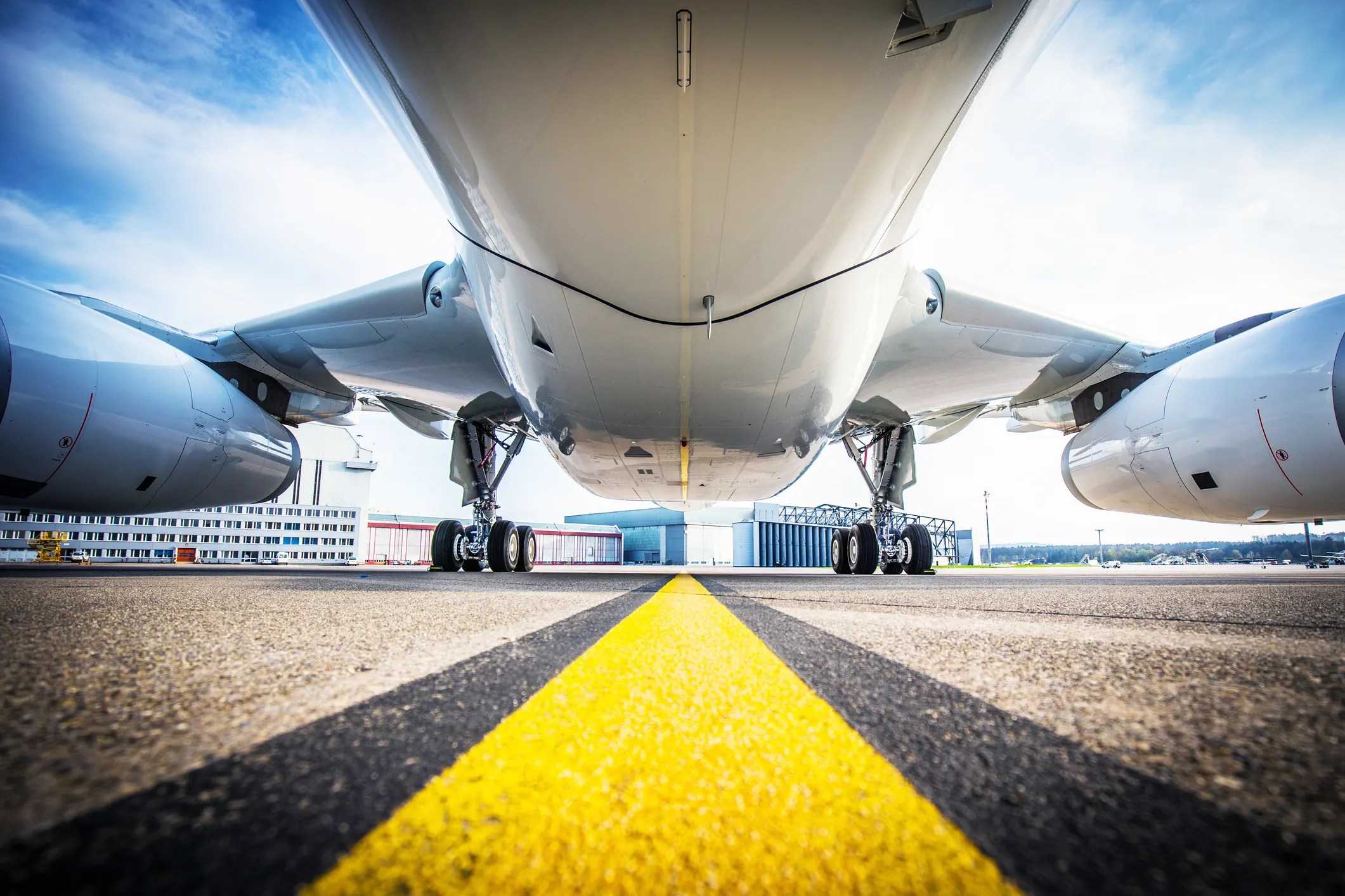 Aircraft fuselage above runway that may follow SAE AMS 2249H for titanium