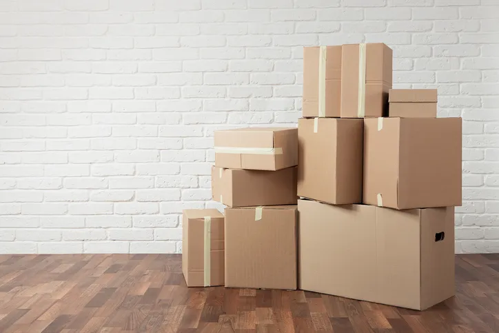 Stack of boxes that have been test on by ASTM D5276-19