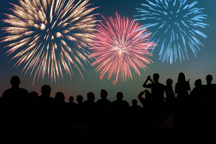 Fireworks featured in ISO 25947 collection exploding before an excited holiday crowd.