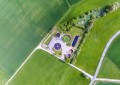 A vibrant green AWWA G520-2017 wastewater collection system used for operation and management.