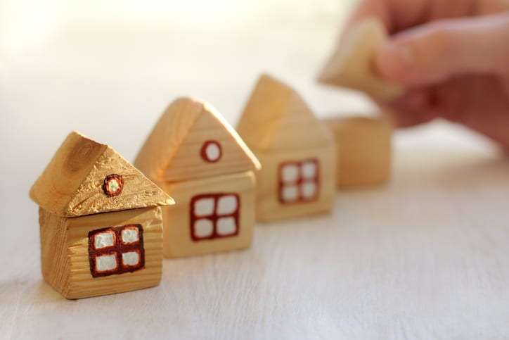 Small wooden houses following ANSI/ASHRAE 55-2023 for thermal environmental conditions.