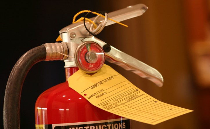 Portable fire extinguisher with tag tested to NFPA 10-2018