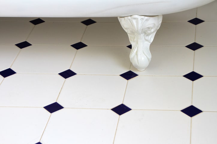 Porcelain bath tub over ANSI A137.1 tested ceramic tile.