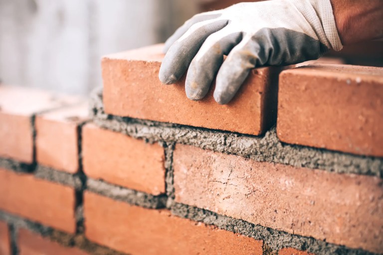 Laying brick with materials of the Unified Soil Classification in ASTM D2487-17