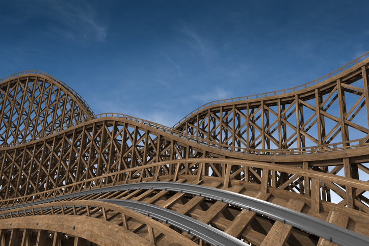A wooden roller coaster follows ASTM F770-18 to provide safe amusement.
