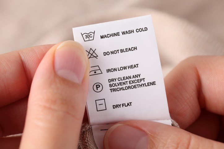 Clothes tag with laundry symbols outlined in ISO 3758:2012