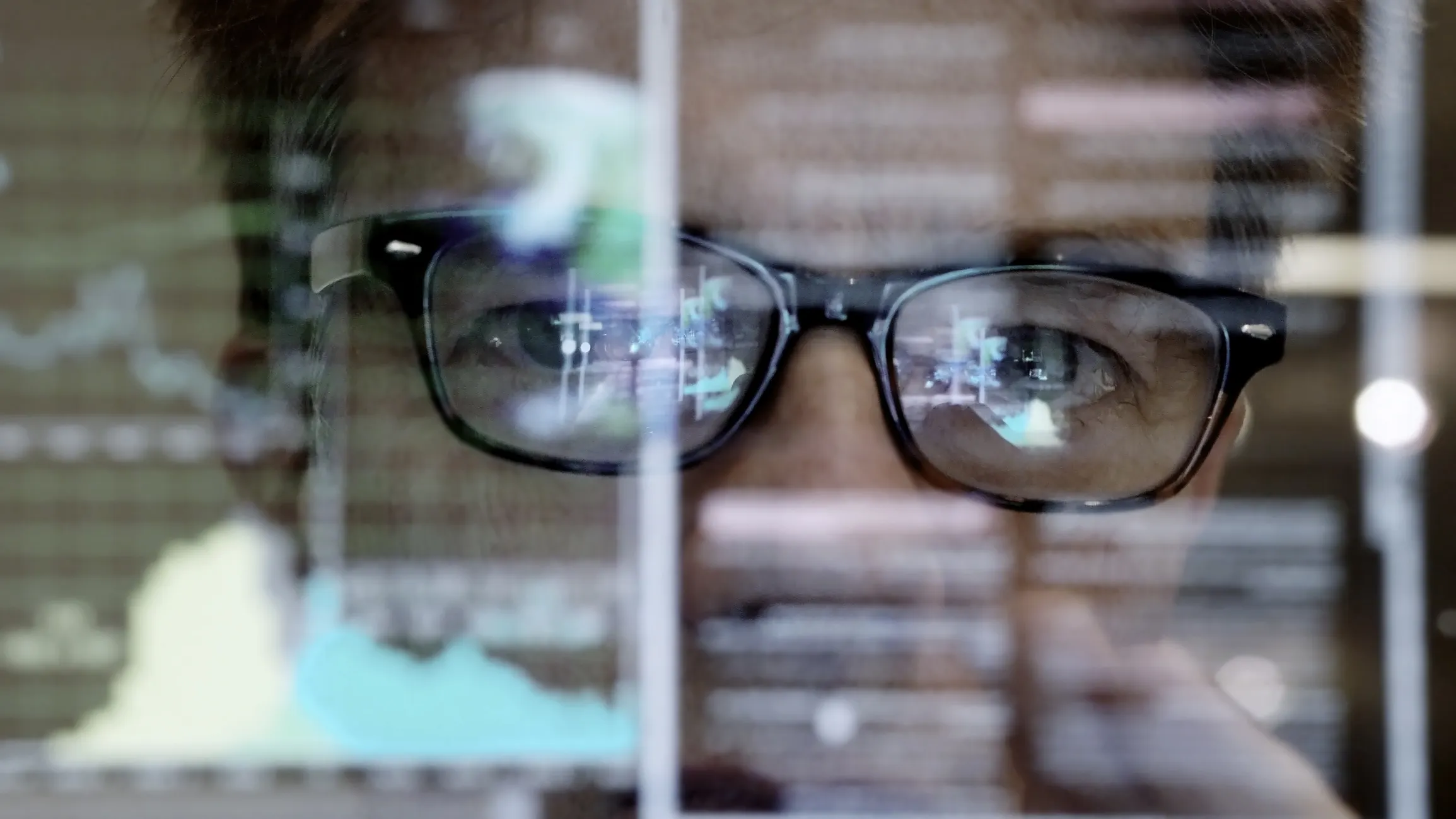 SQL code reflecting in man's glasses and specified in ISO IEC 9075 2016