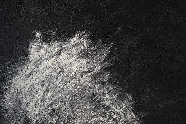 Combustible dust spread on black surface and spread with NFPA 652-2019