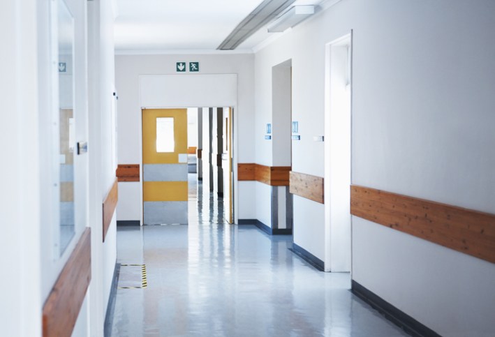 Creepy hospital hall way adhering to NFPA 101A 2019 for health care occupancy in relation to life safety.
