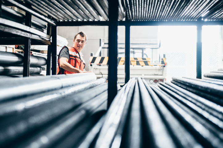 Man gazing at ASTM A513-18 Electric-Resistance-Welded Carbon and Alloy Steel Mechanical Tubing