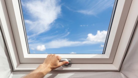 A skylight under the blue sky and clouds installed via CAN/CSA A440.4-2019 performance requirements.